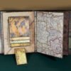 Álbum scrapbooking con tema "Mapas".